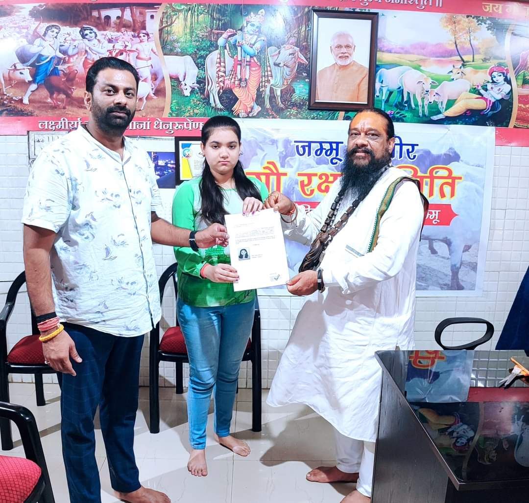 A domicile certificate being handed to a senior citizen at their doorstep in Jammu