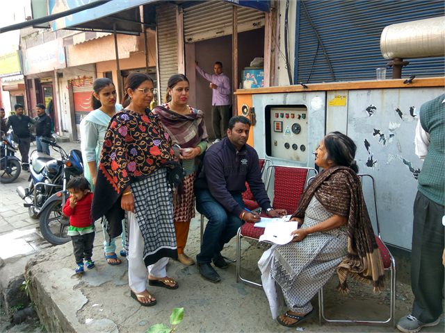 Helping Locals To Fill Bank Form During Notebandi