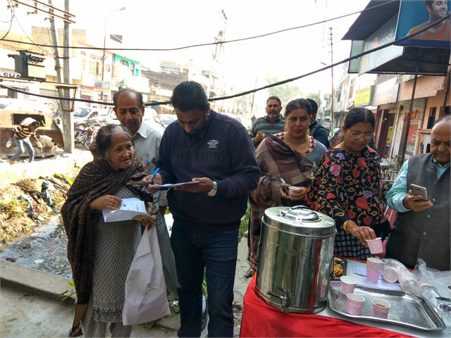 Helping Locals To Fill Bank Form During Notebandi