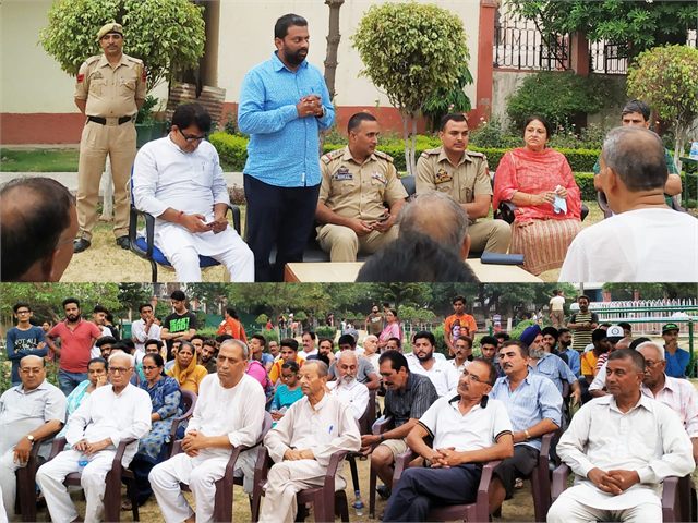 Organising Police Public Meeting attended by Senior Superintendent of Police Vinod Kumar IPS