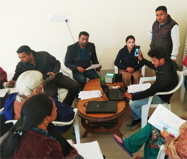 Providing Aadhaar Card to a Old Age Women at her doorstep