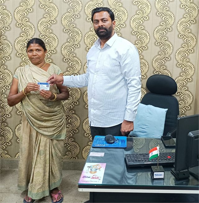 Providing Voter Card to a Old Women